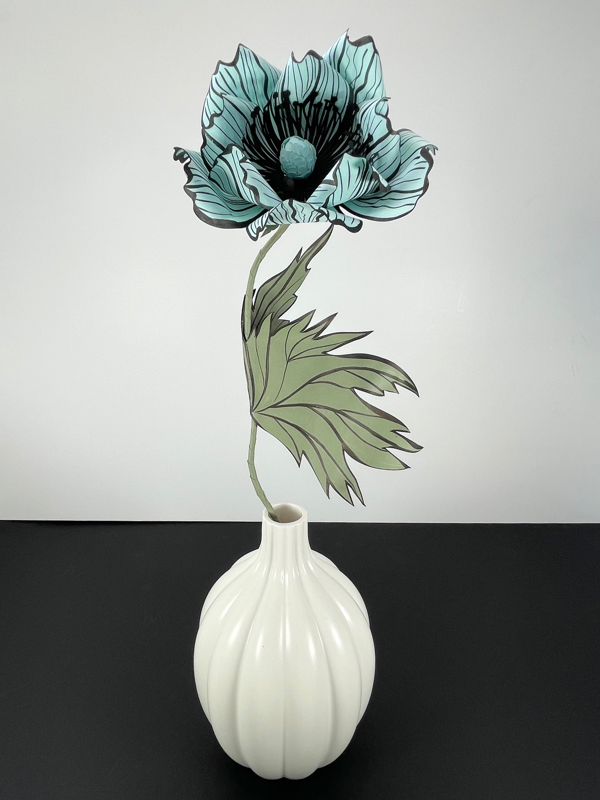 Aqua blue poppy flower stem